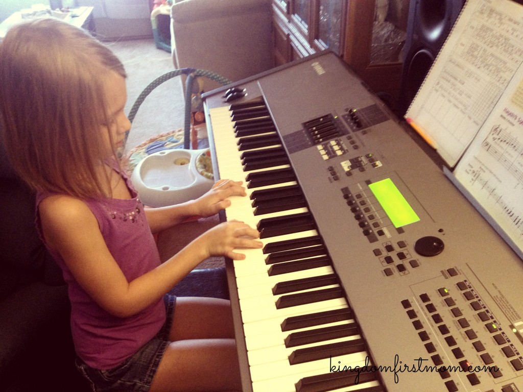 Reese practicing her piano lessons